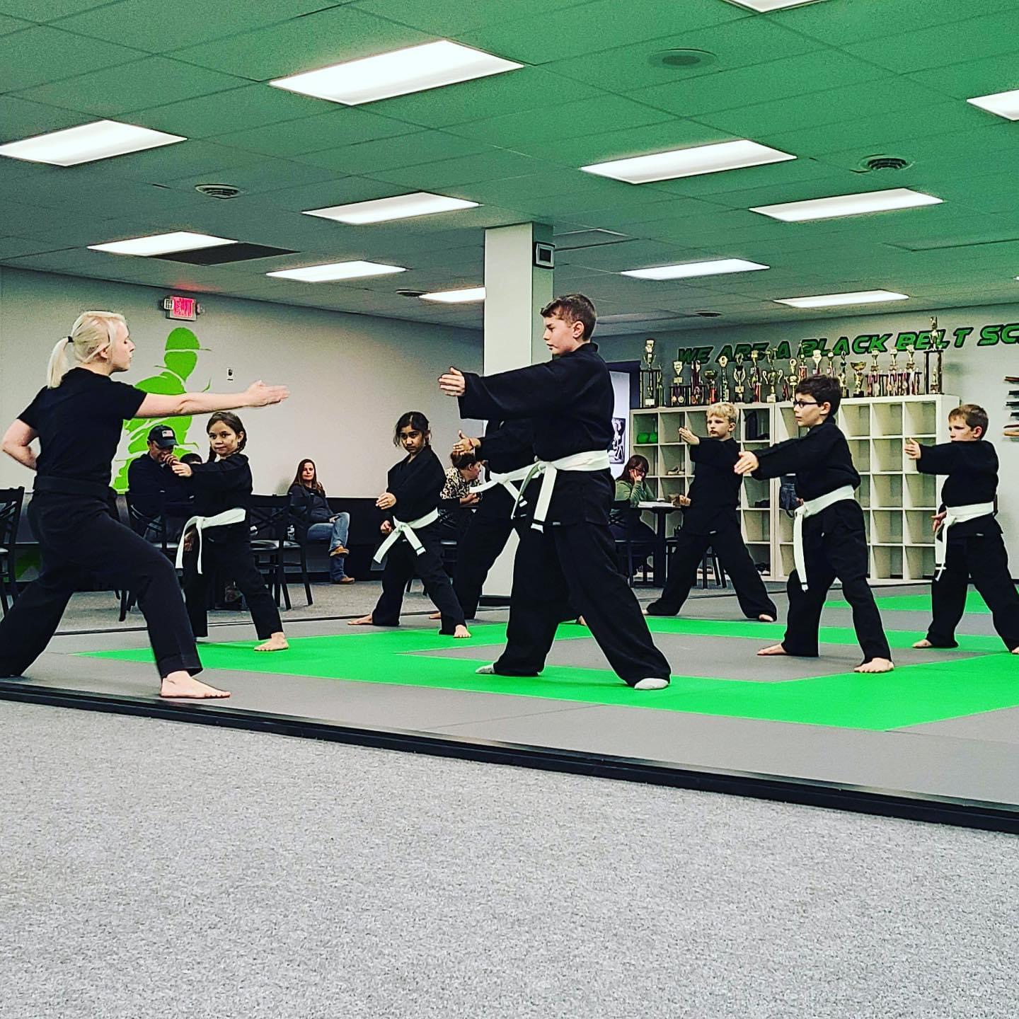 Students practicing forms and stances at Fusion