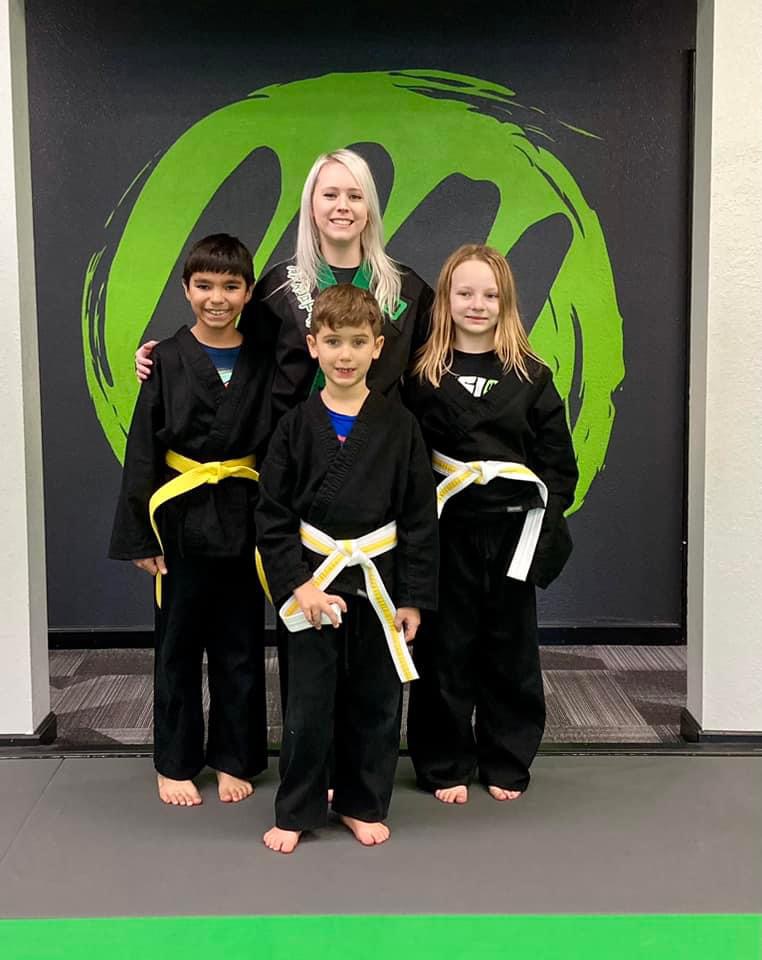 Young students at a belt promotion at Fusion Martial Arts