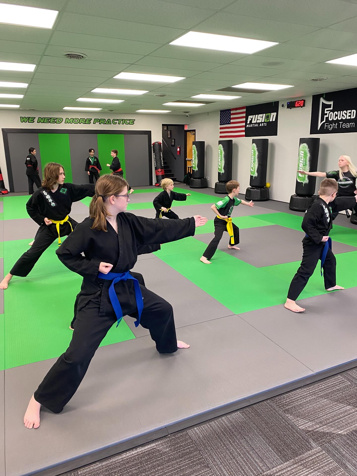 Kids practicing martial arts forms at Fusion
