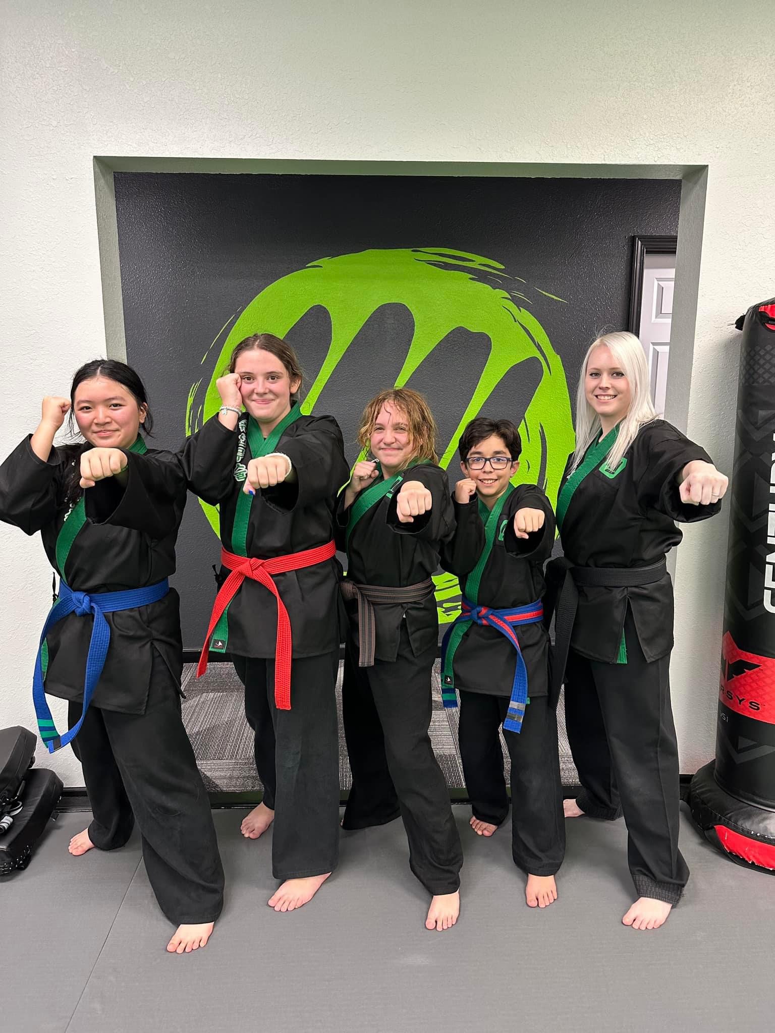 Kids with their new belts at Fusion Martial Arts in Bloomington, IL