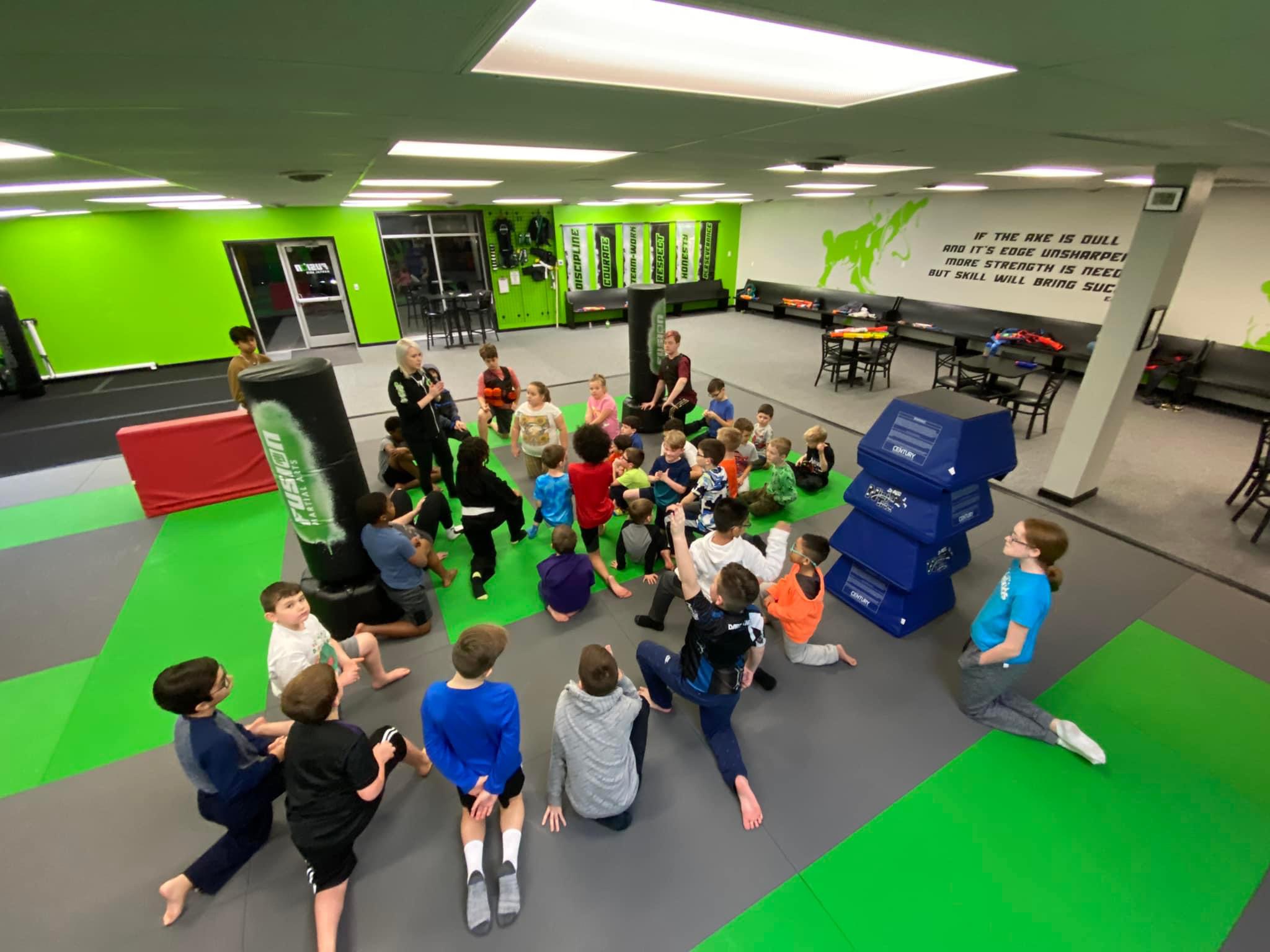 Instructor leading a kids class at Fusion