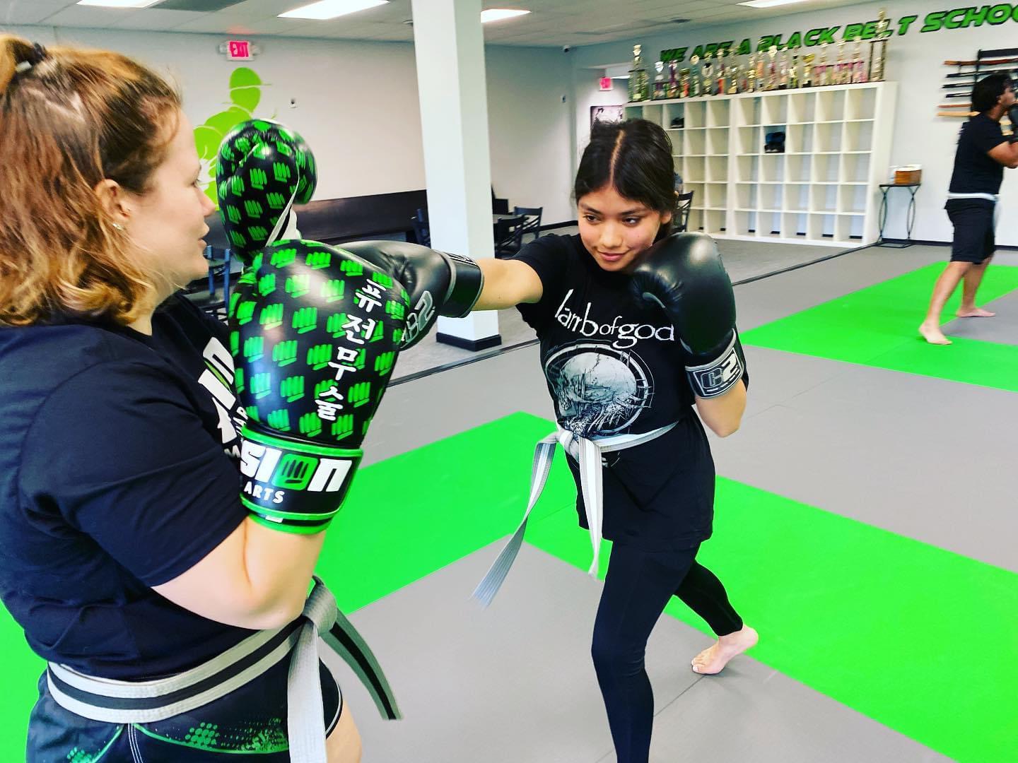 Adult Muay Thai partner drill at Fusion