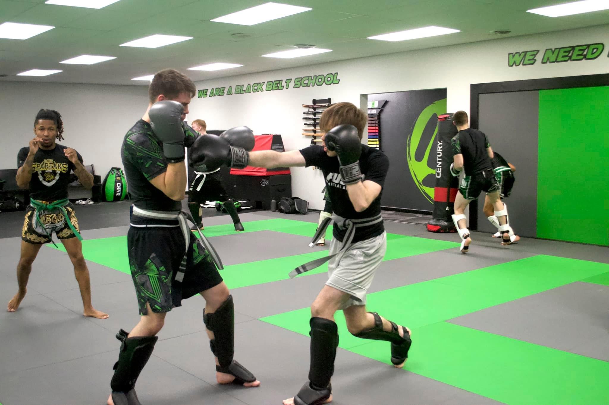 Adult Muay Thai partner training at Fusion