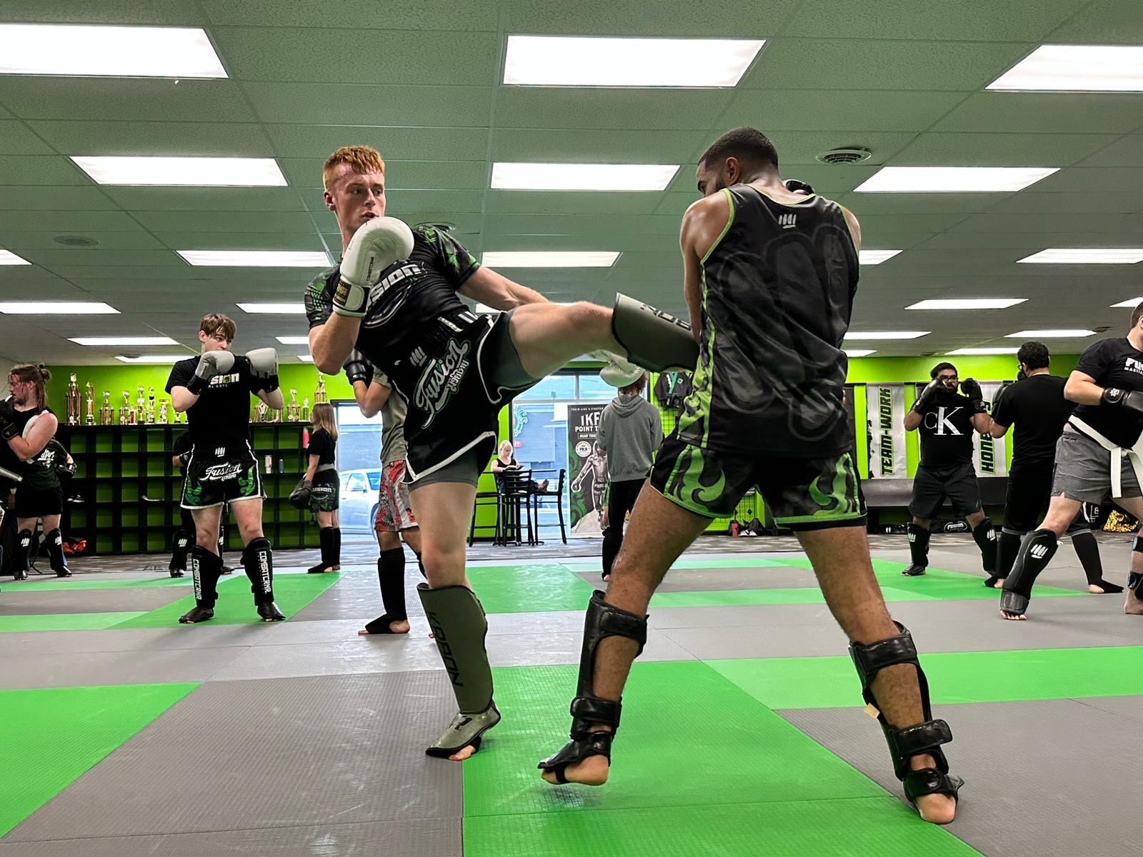 Adult Muay Thai kickboxing training at Fusion