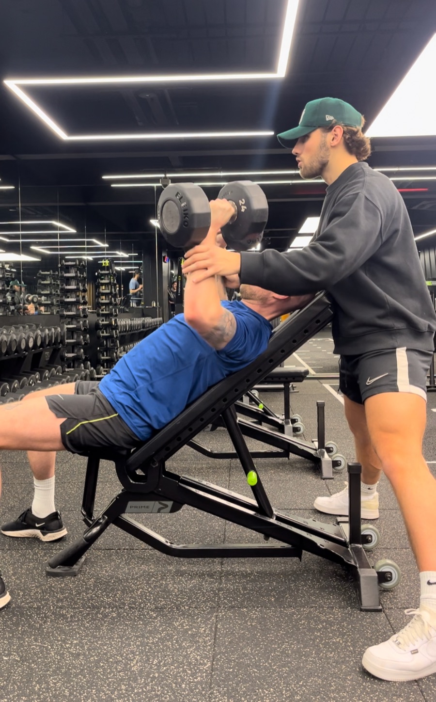 Joey Fox spotting a client on incline press