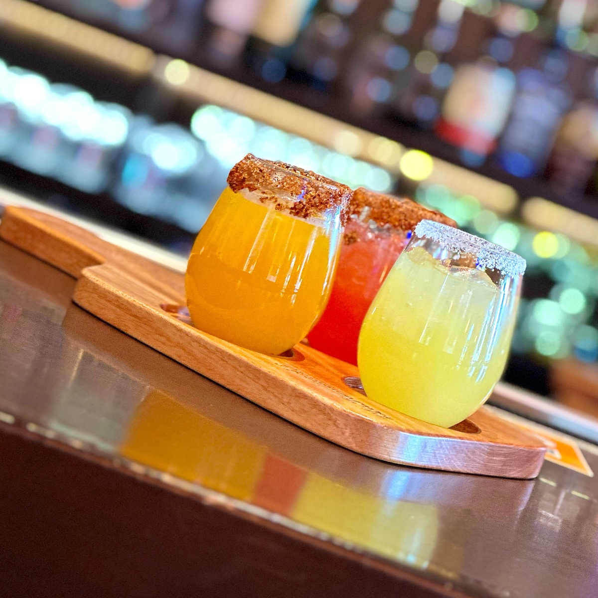 Rita Flight: three margaritas on a wooden paddle