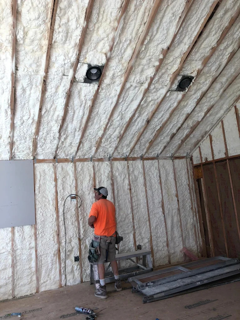 Beto, founder of Xpress Drywall, working on a job site