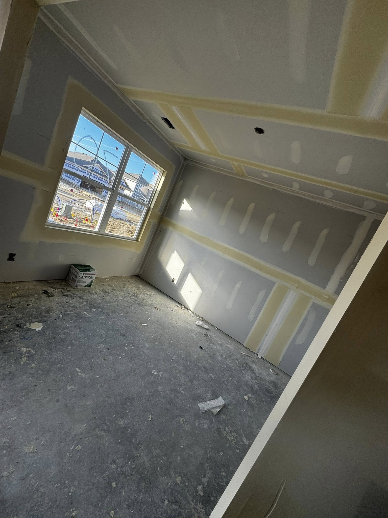 Finished room — drywall installed and paint-ready