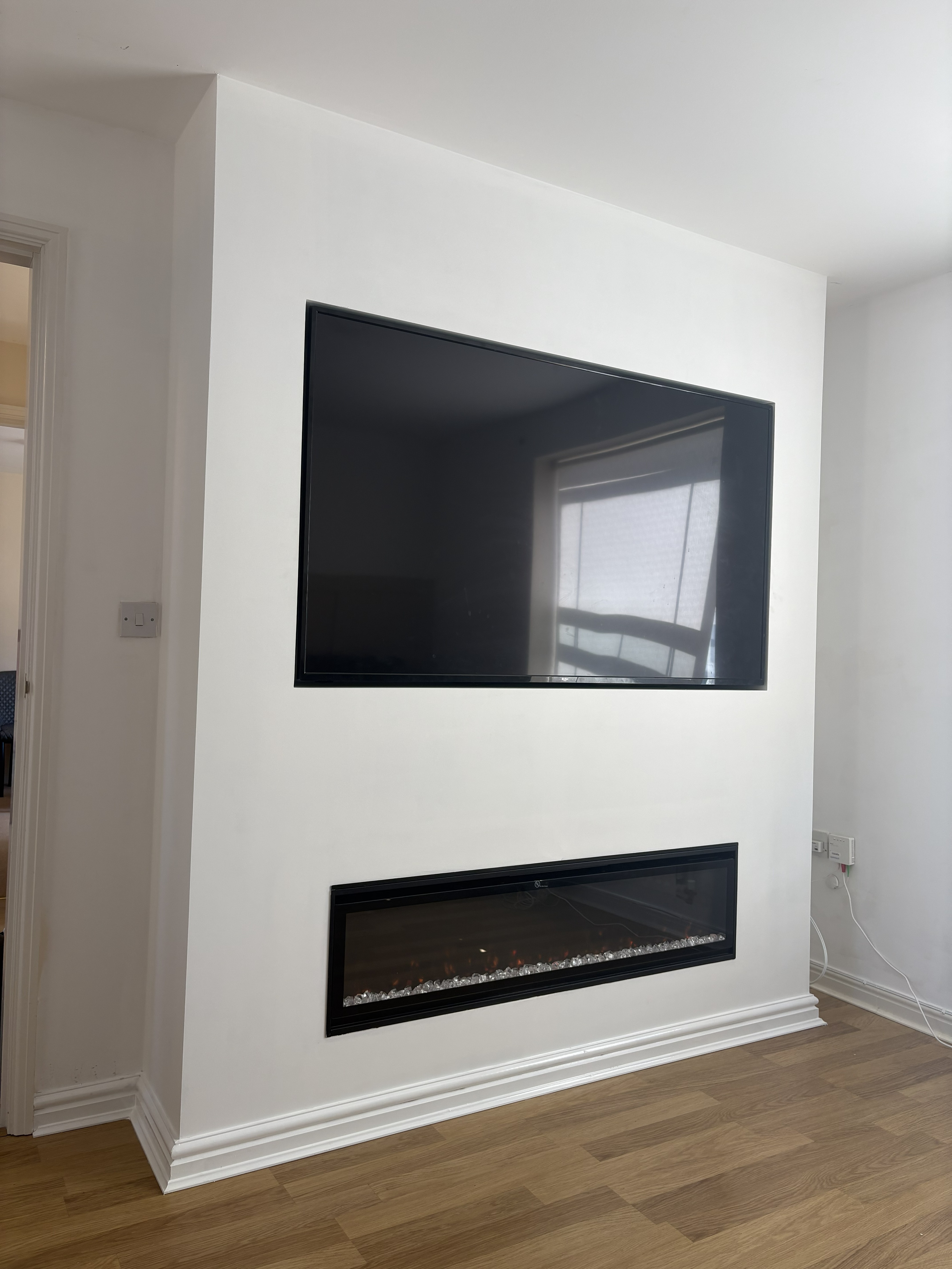 Media wall with TV and fire