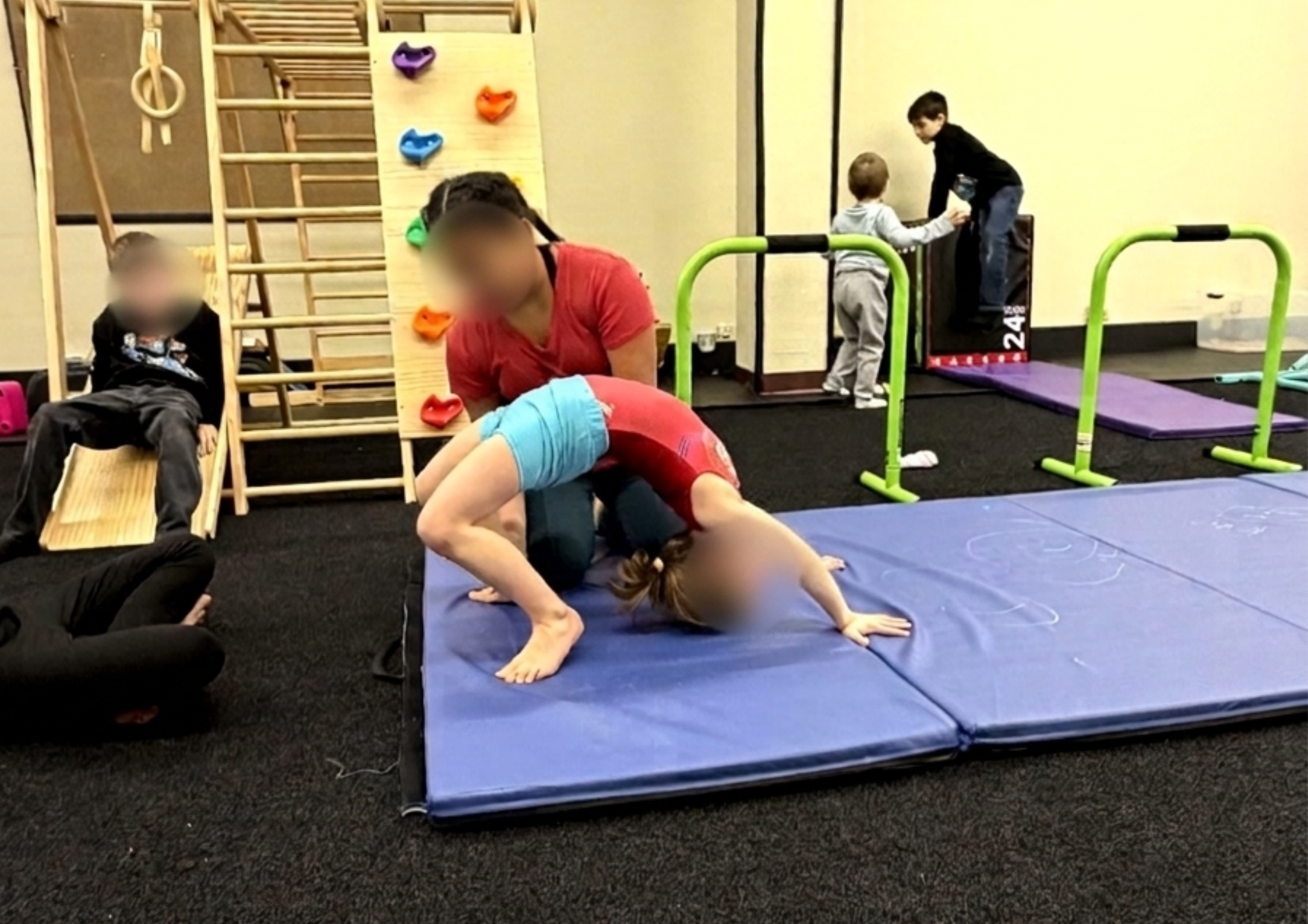 Children practicing gymnastics and teamwork during a physical activity session at Apogee CT, building strength, confidence, and social skills.