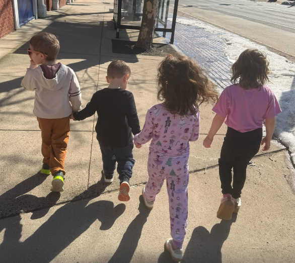 Children walking side by side. 