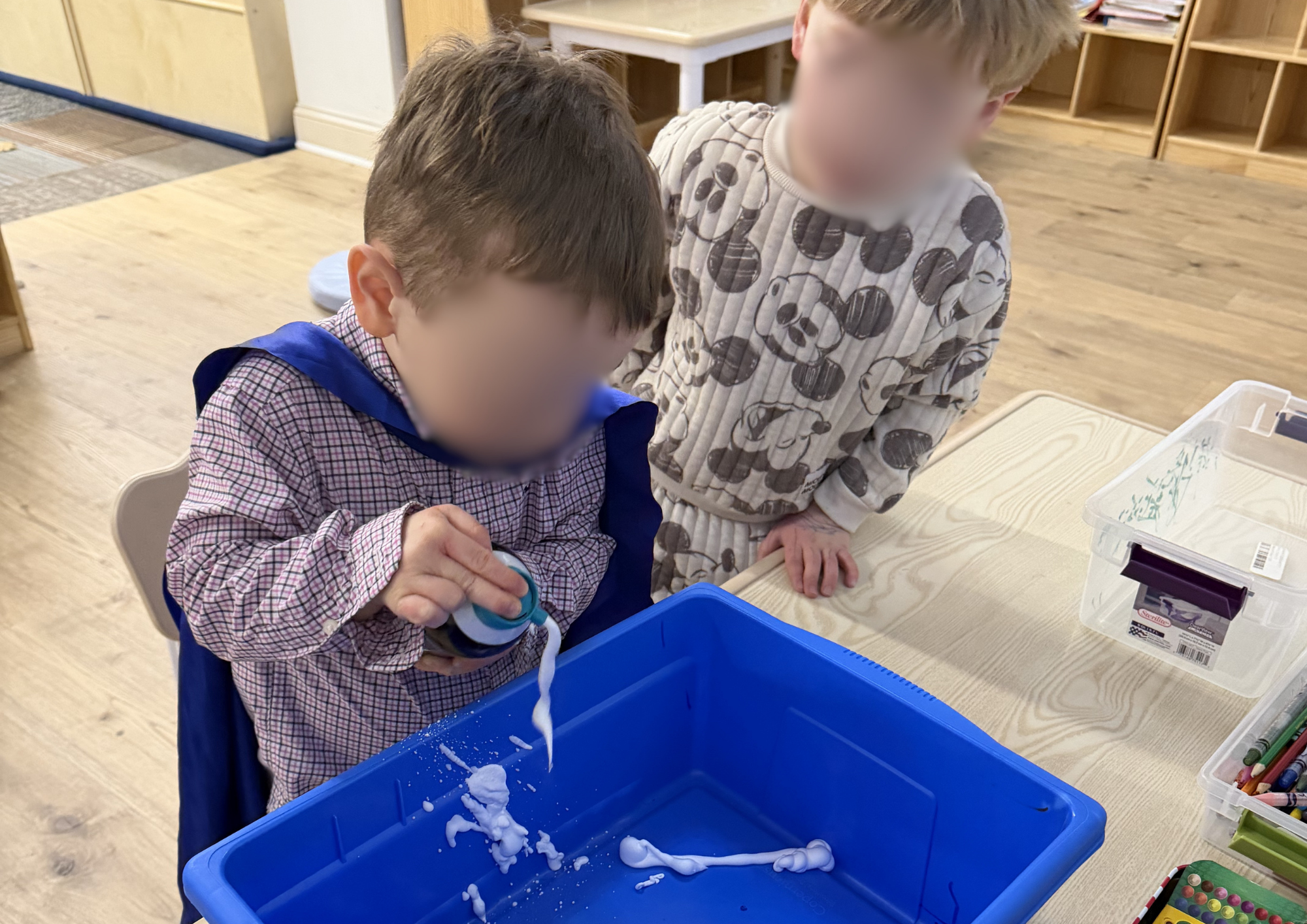 A young boy doing a creative DIY activity shows fun, learning, and sensory play for kids, highlighting a hands-on craft experience in a bright and playful indoor setting.