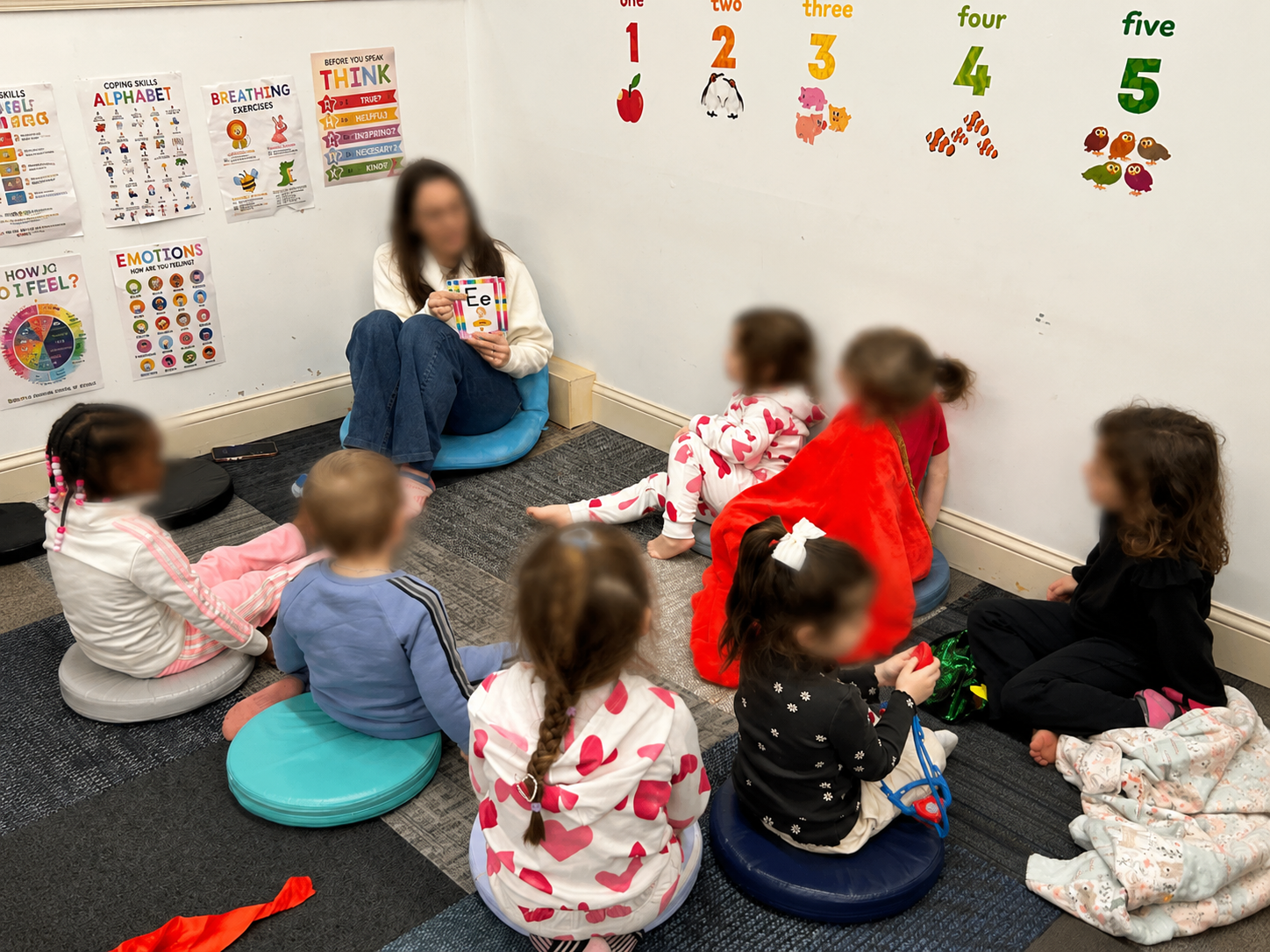Reading to young children during circle time, supporting early literacy, problem-solving skills, and independent learning at Apogee CT. Reading to young children during circle time, supporting early literacy, problem-solving skills, and independent learning at Apogee CT.