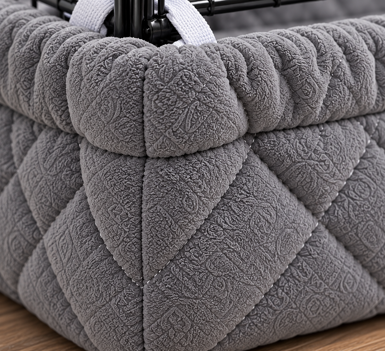 A close view of the quilting and stitched edge