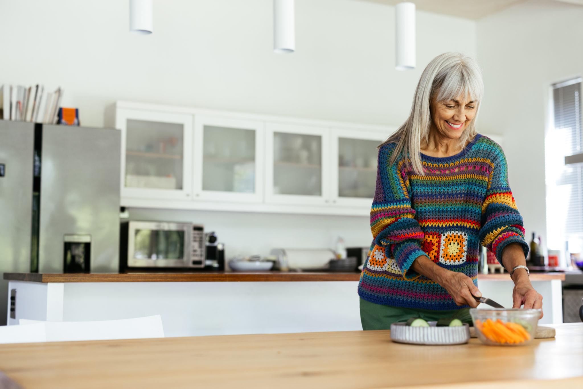 mature woman preparing a healthy meal 
