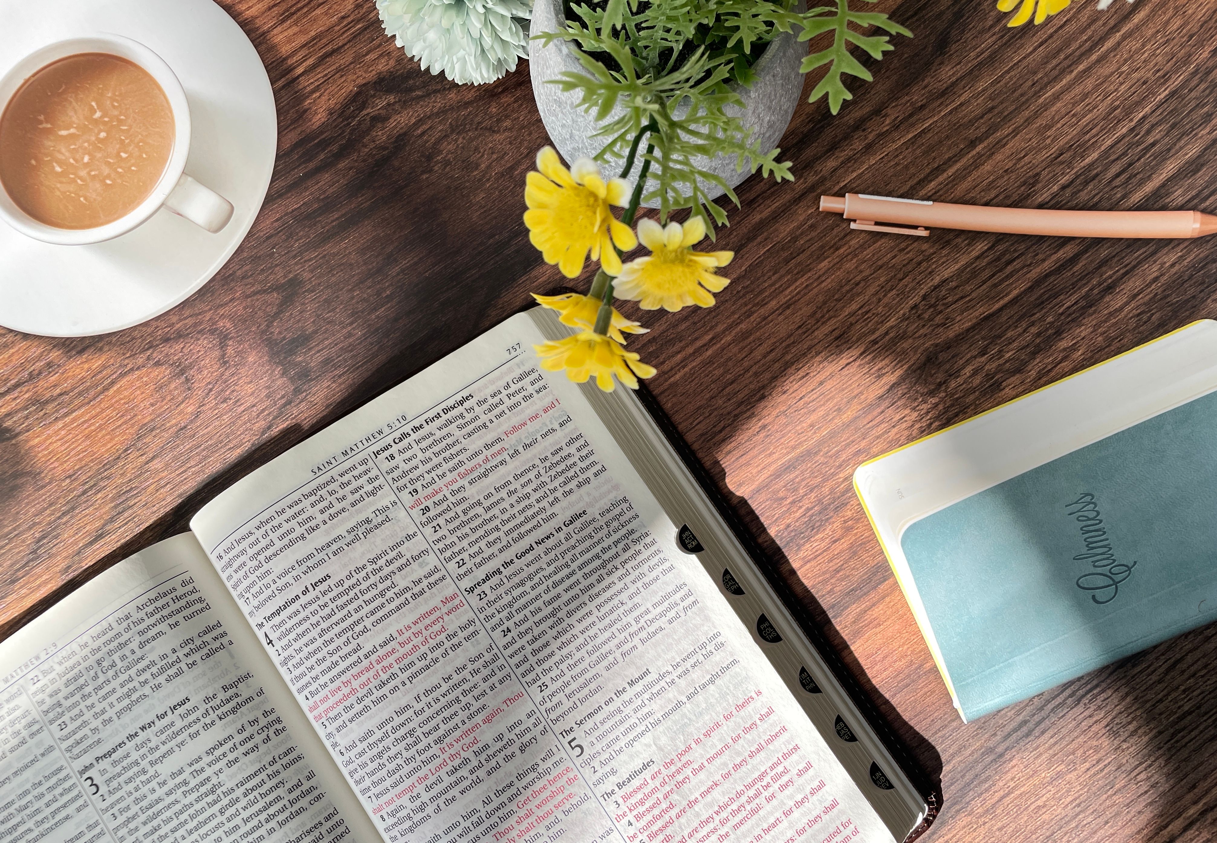 Open Bible, notebook and coffee prepared for a quiet morning routine Open Bible, notebook and coffee prepared for a quiet morning routine
