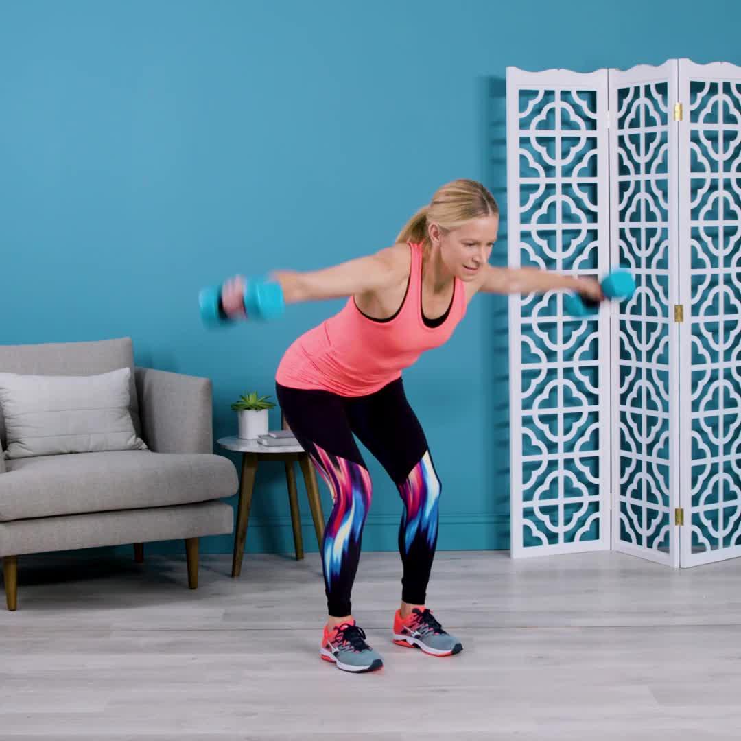 Midlife woman performing upper-back posture exercises to strengthen rounded shoulders Midlife woman performing upper-back posture exercises to strengthen rounded shoulders