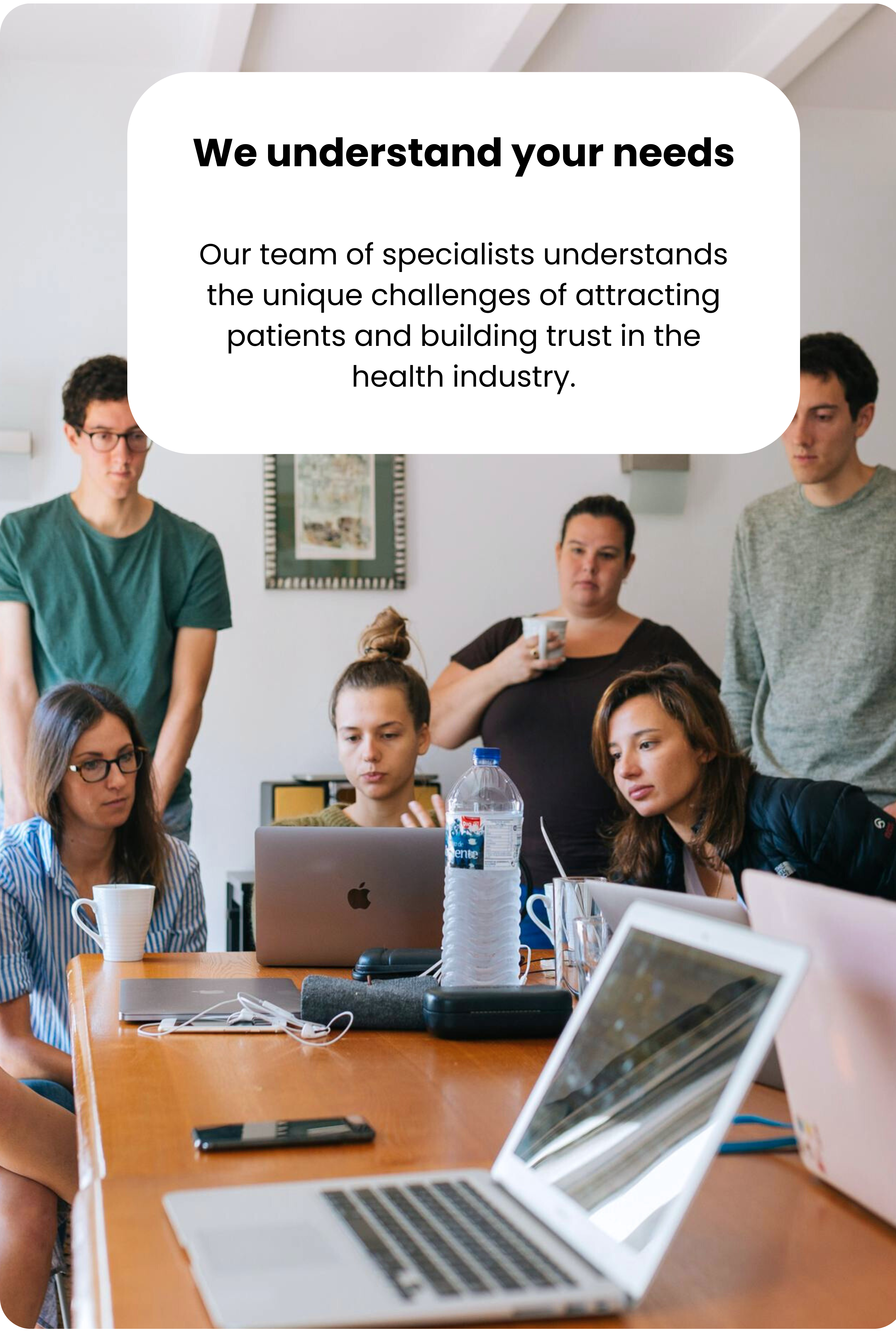 We speak your language. Our team of specialists understands the unique challenges of attracting patients and building trust in the health industry." MediClicks medical marketing team meeting.
