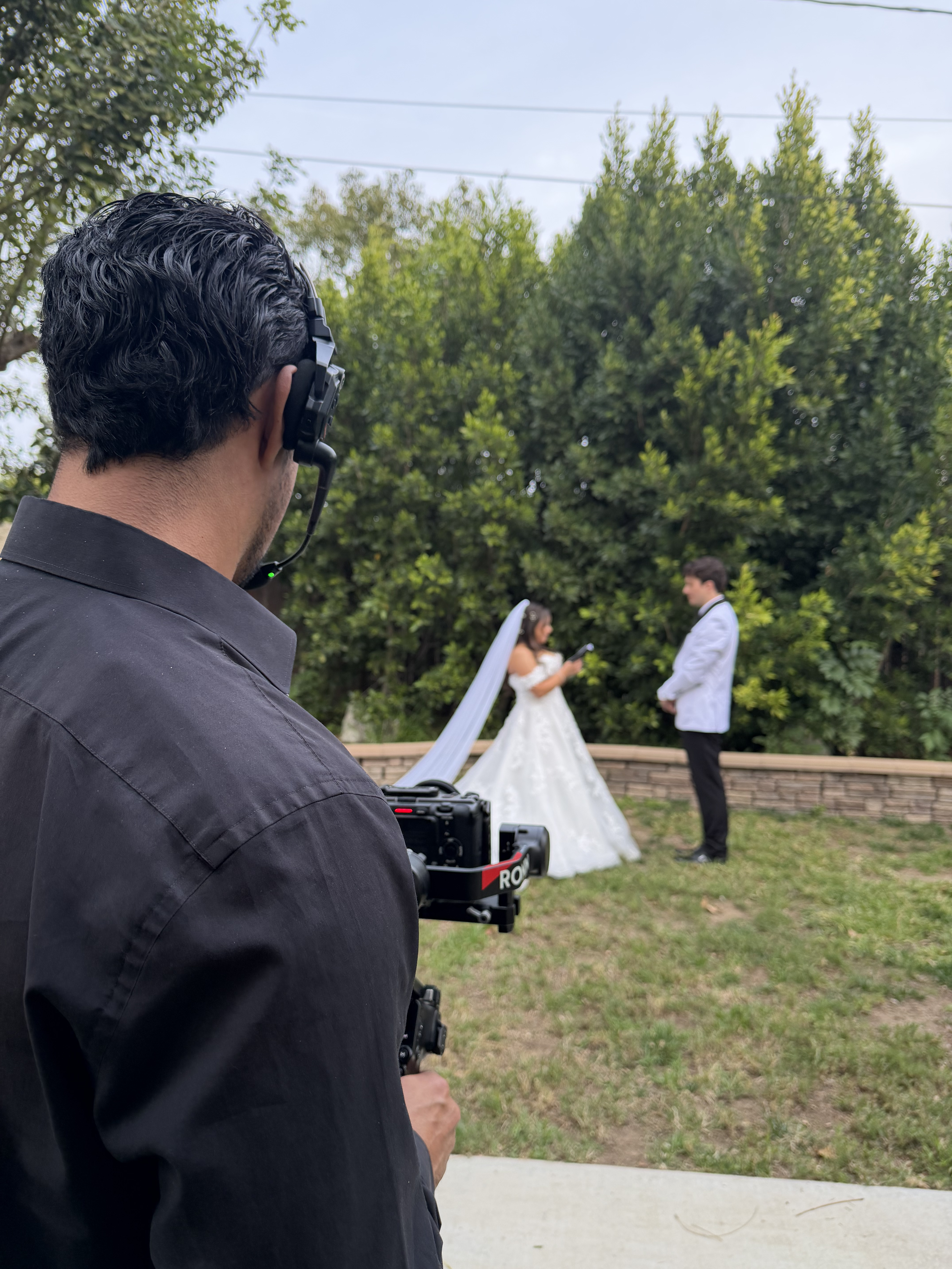 Filming an outdoor wedding ceremony