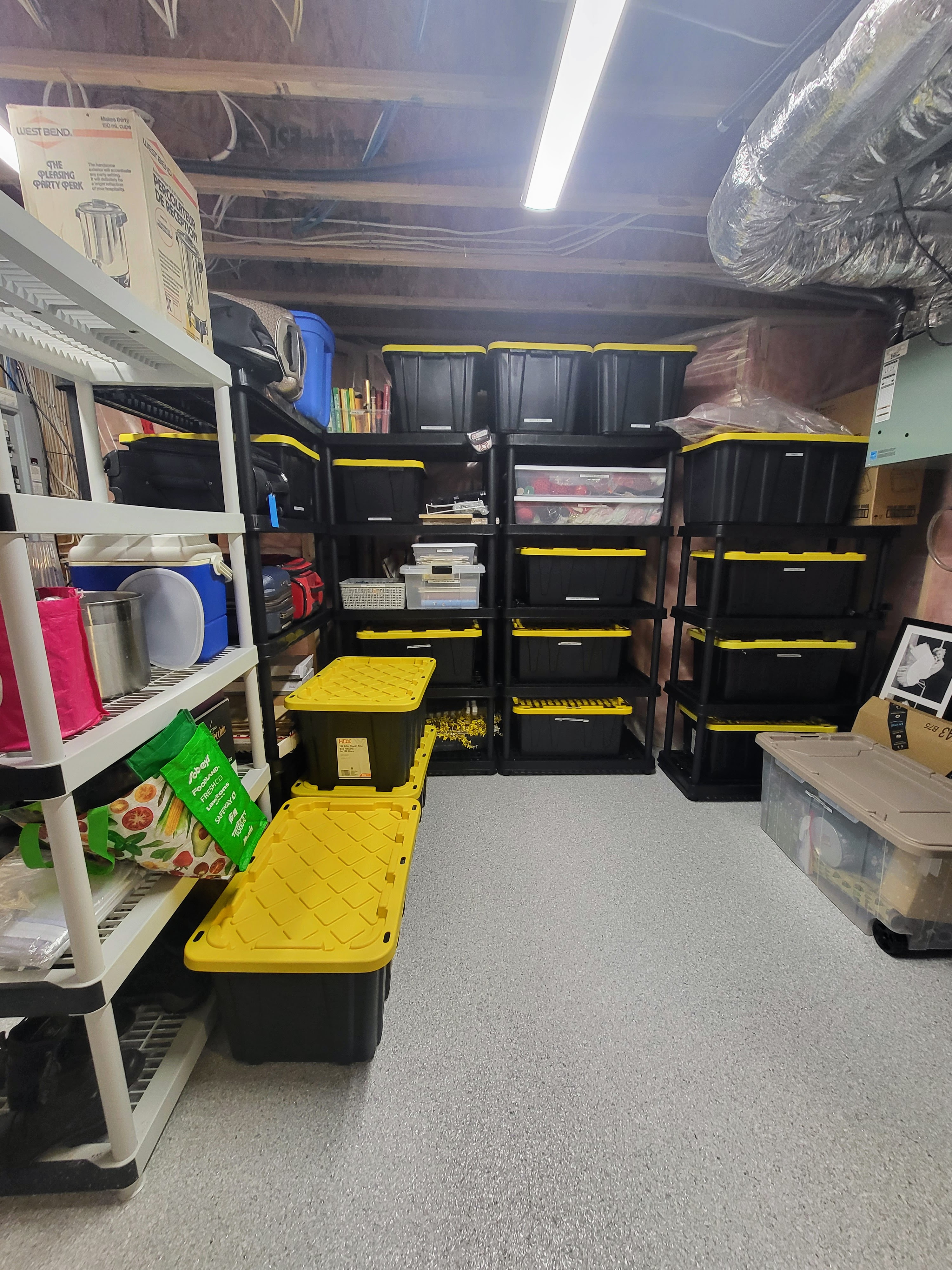 bins stacked on shelving in organized storage room bins stacked on shelving in organized storage room
