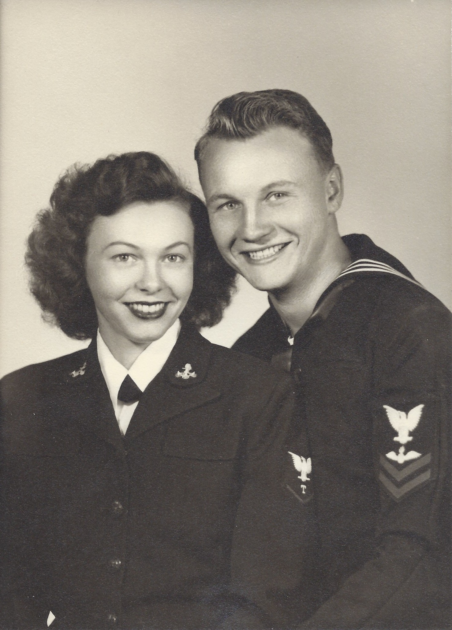 Black-and-white wedding portrait of Bob and Wid in their U.S. Navy uniforms during World War II.
