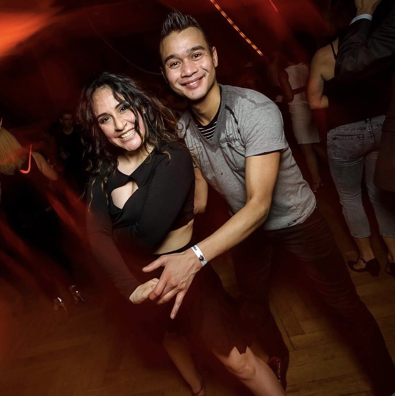 A couple dancing Salsa at a Baila Beats social night