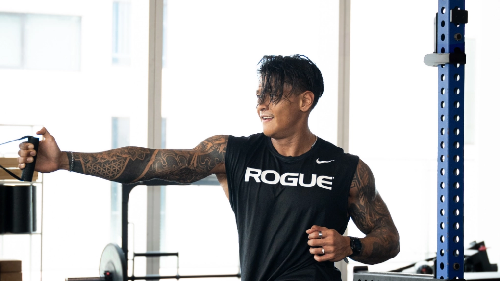 Athlete performing barbell deadlift in Athletic gym