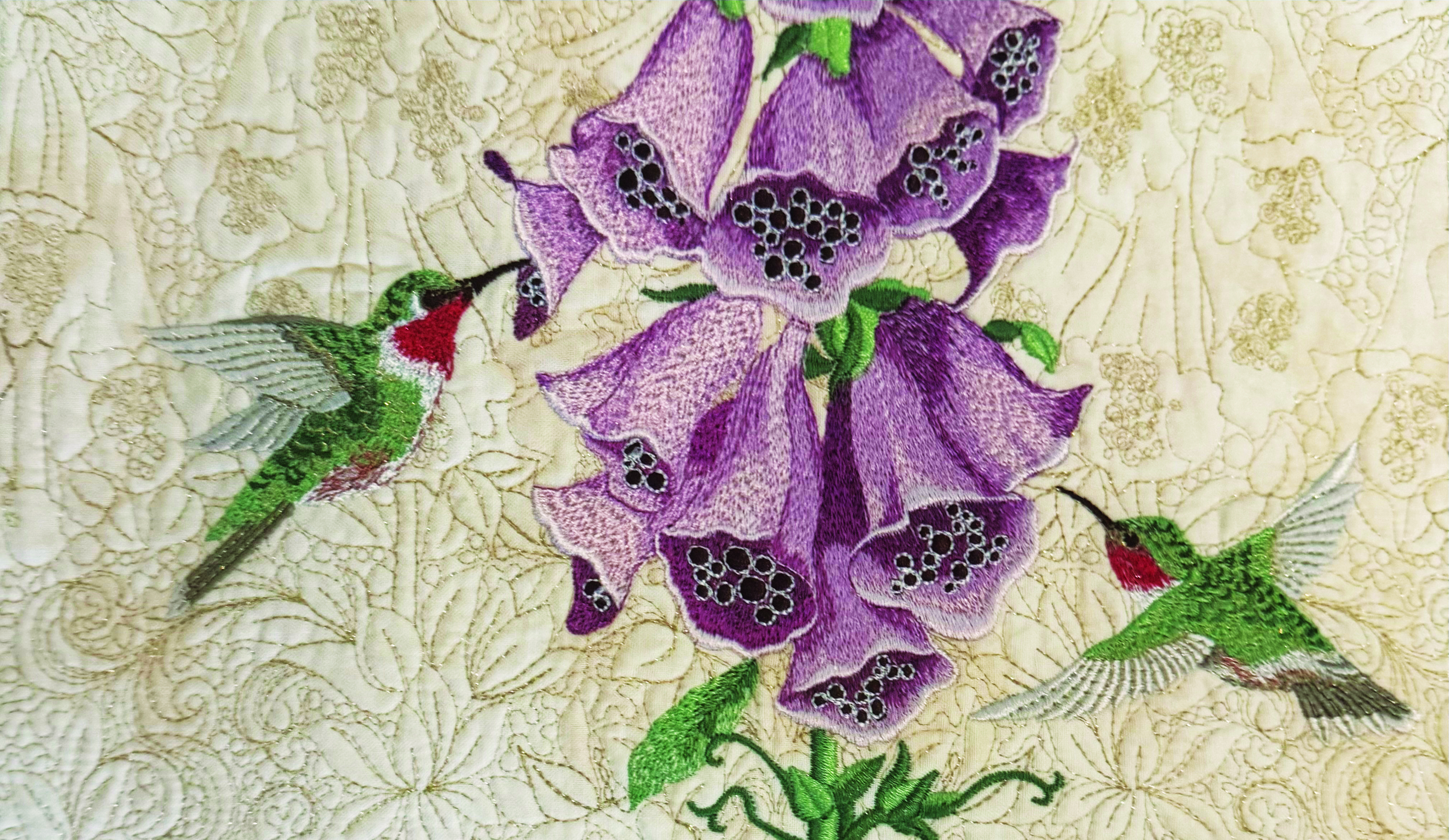 Delicate pastel fuchsias and leaves on embroidered fabric