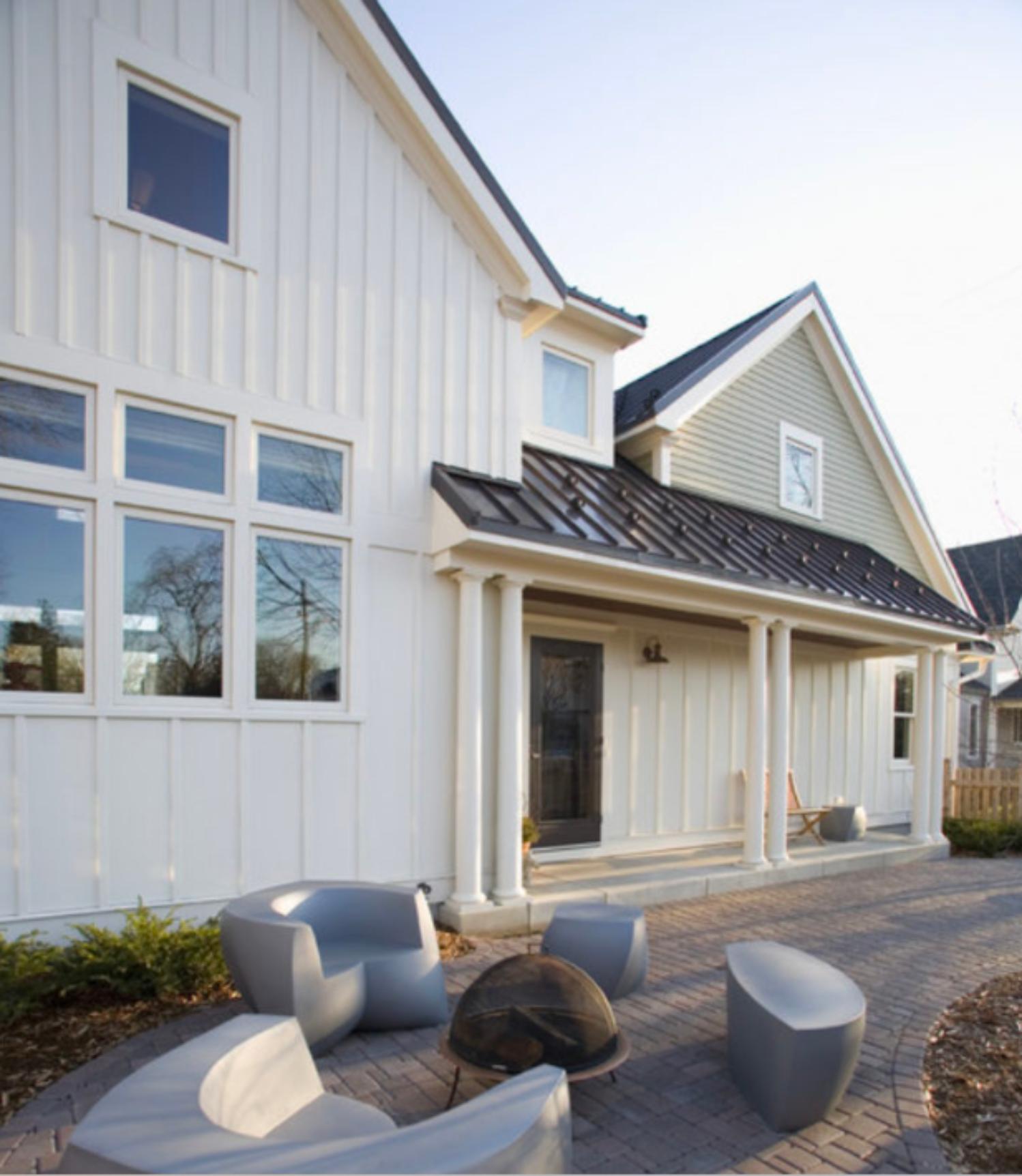 White farmhouse with new replacement windows