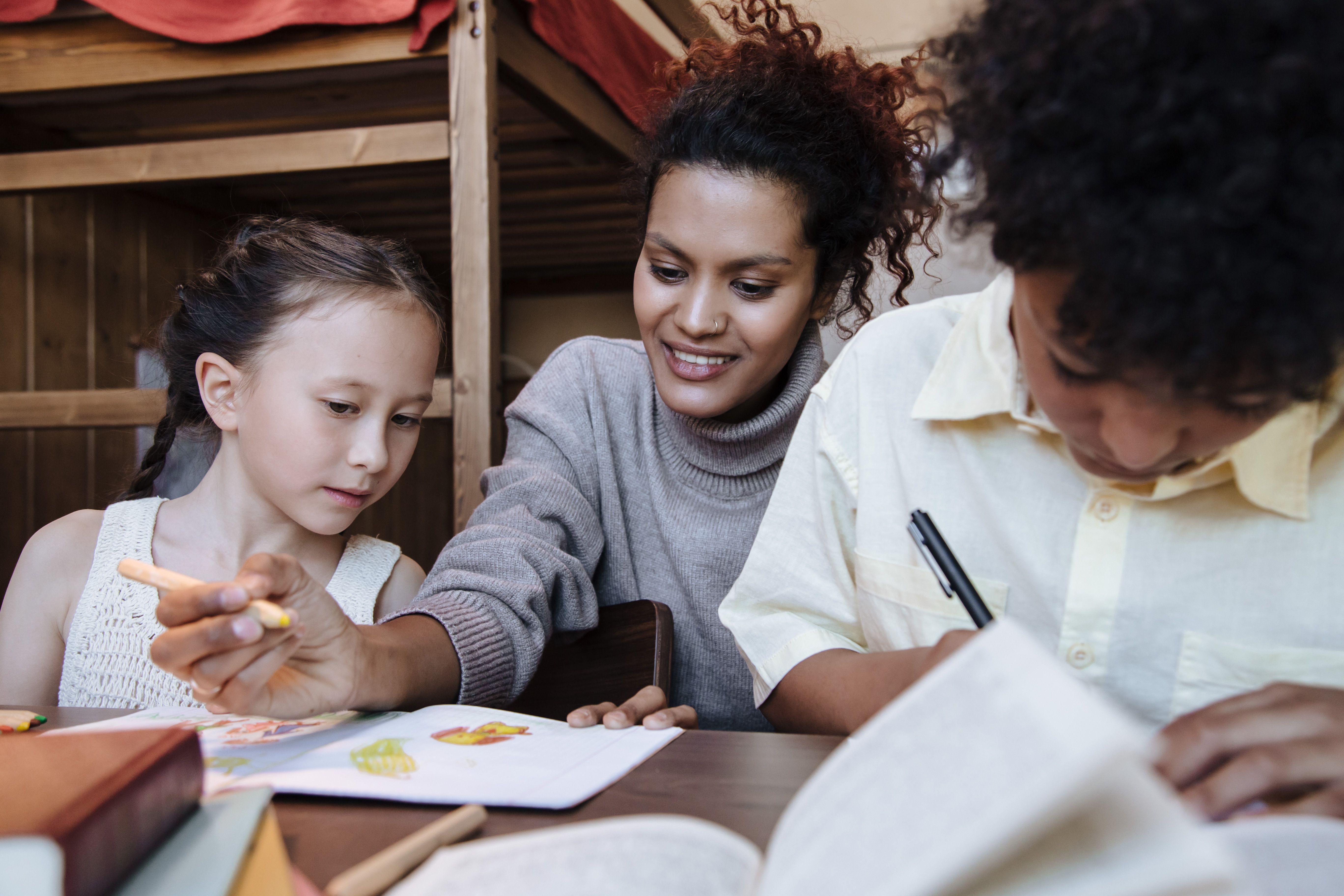 Mother teaching children to serve others through kindness, responsibility, and family life Mother teaching children to serve others through kindness, responsibility, and family life