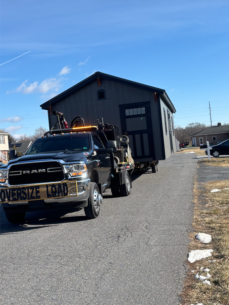 Shed secured on transport trailer
