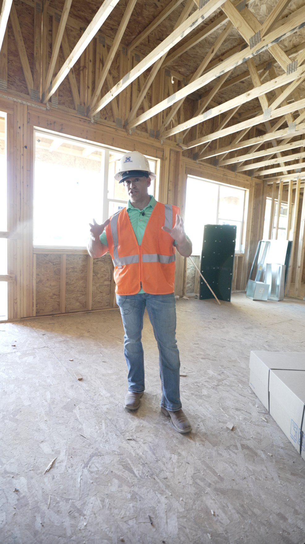 Walking the framed interior of a ground-up build