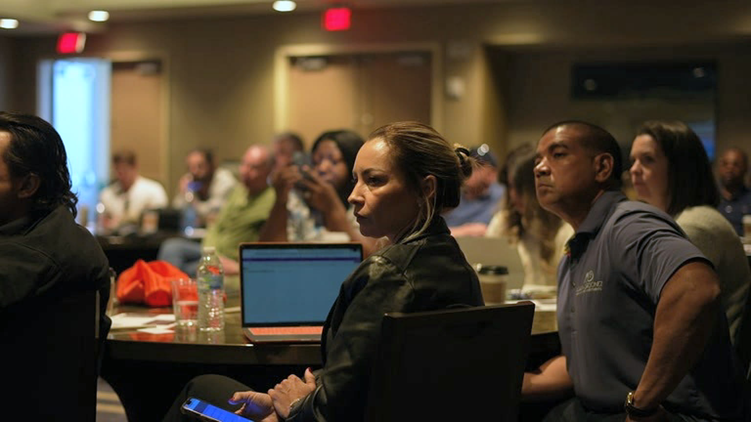 Attendees taking notes during a live session