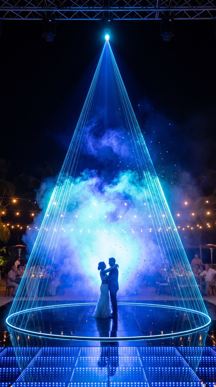 A laser cone around a couple on a dance floor