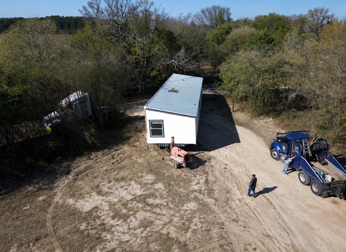 Manufactured home being delivered and professionally set up on a Texas property