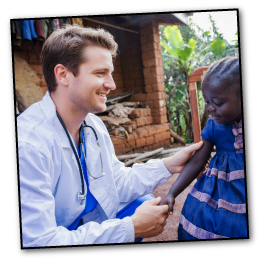 Doctor supported by Little People of Africa Foundation providing medical aid to a child in an African village.