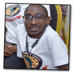 African man with dwarfism receiving support through Little People of Africa Foundation.