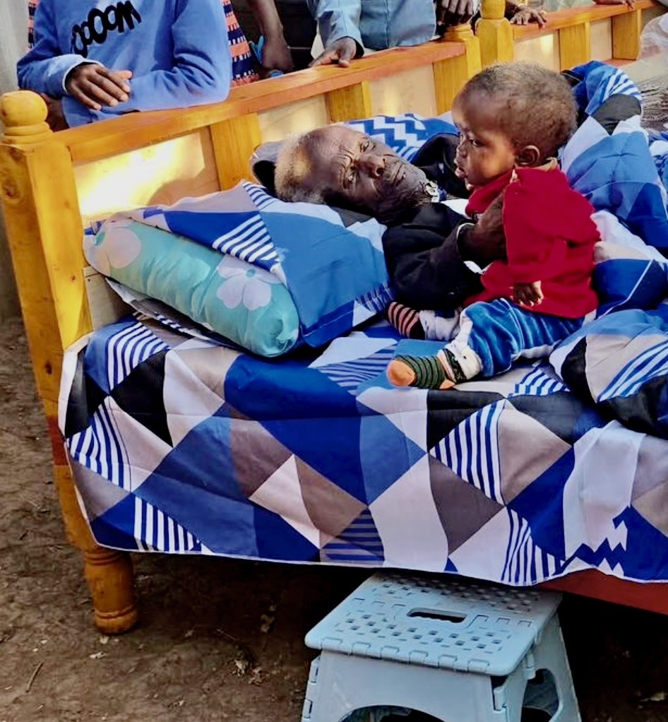 Little person relaxing on donated bed