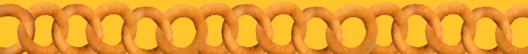 Chain of crispy fried onion rings linked together in a row