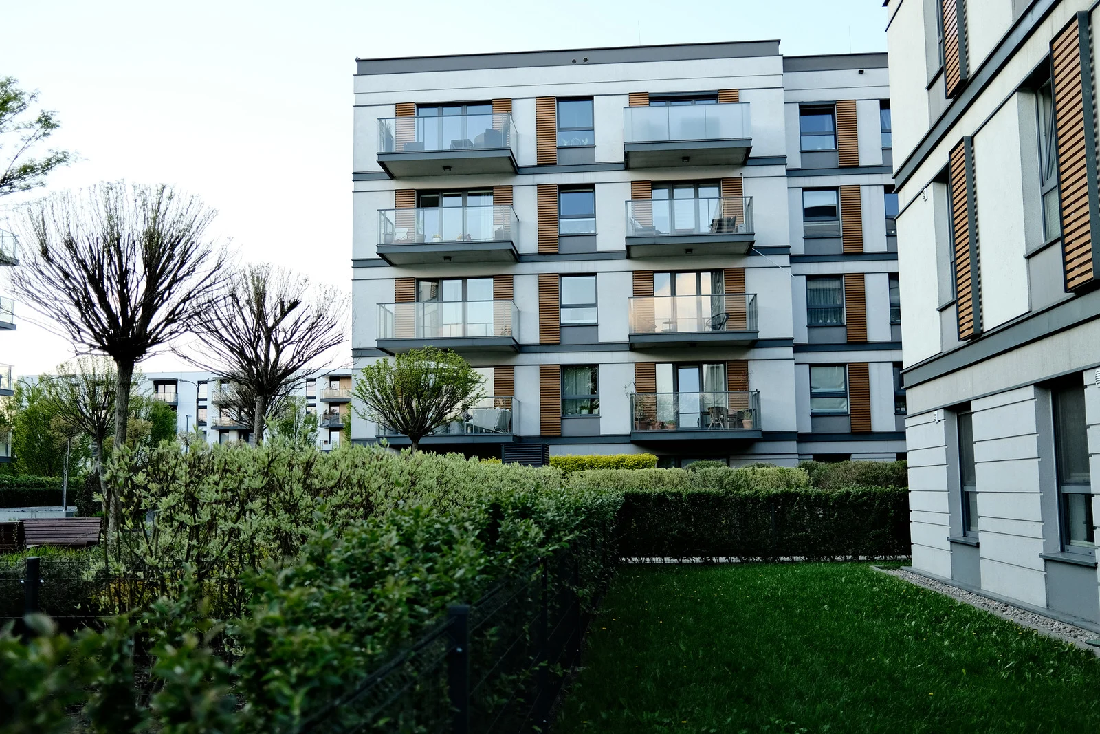Modern apartment building with green lawn