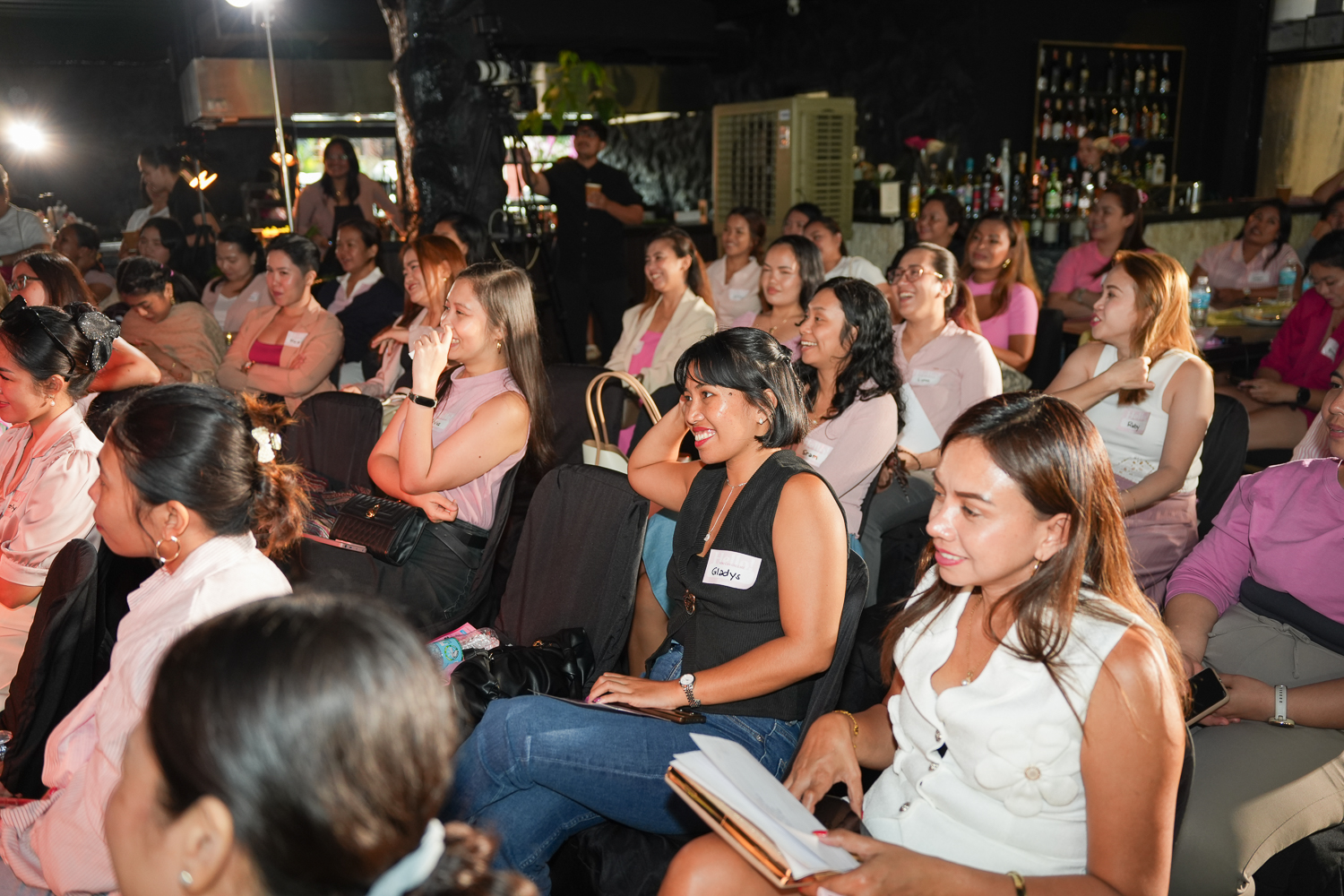 Attendees seated and turned toward the front of the room