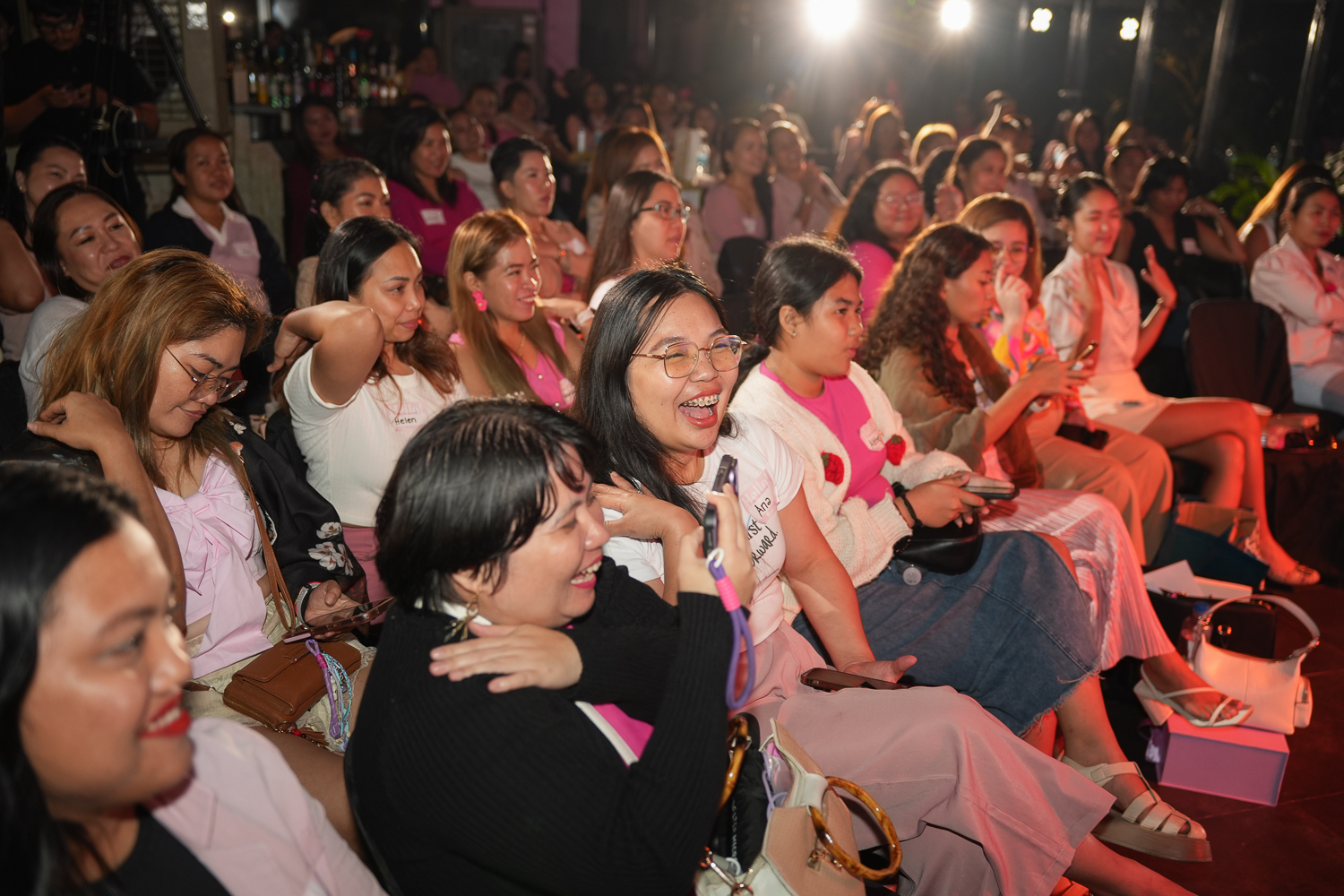 The seated crowd packed shoulder to shoulder