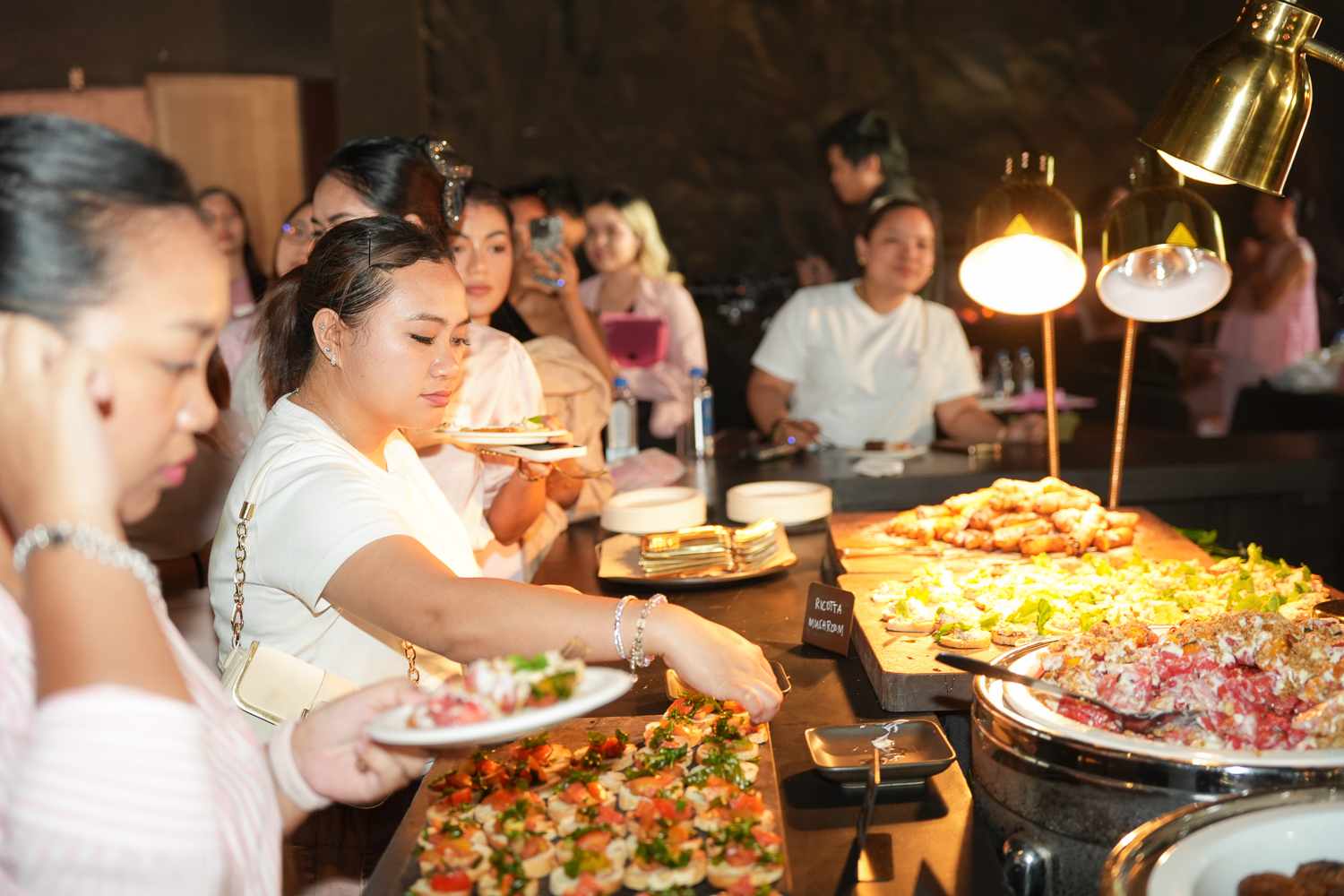 An attendee serving herself at the buffet