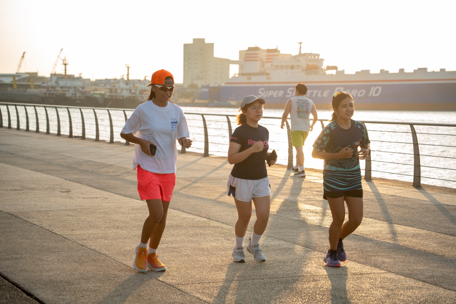 Three members running in the morning light