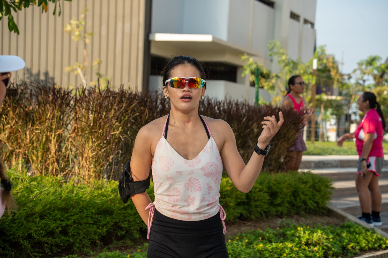 A member with her arms open mid-run