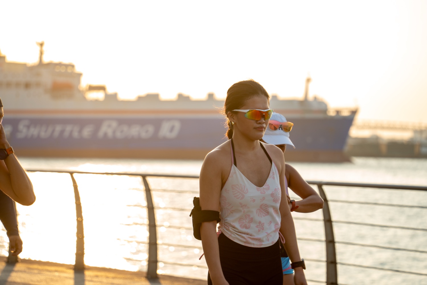 A member pausing for water beside the railing