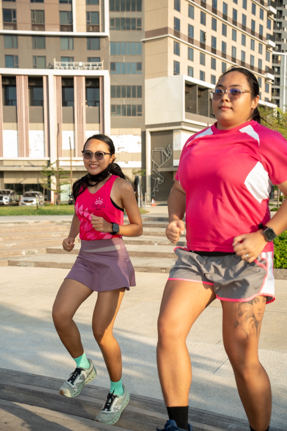 Two members running side by side in the city