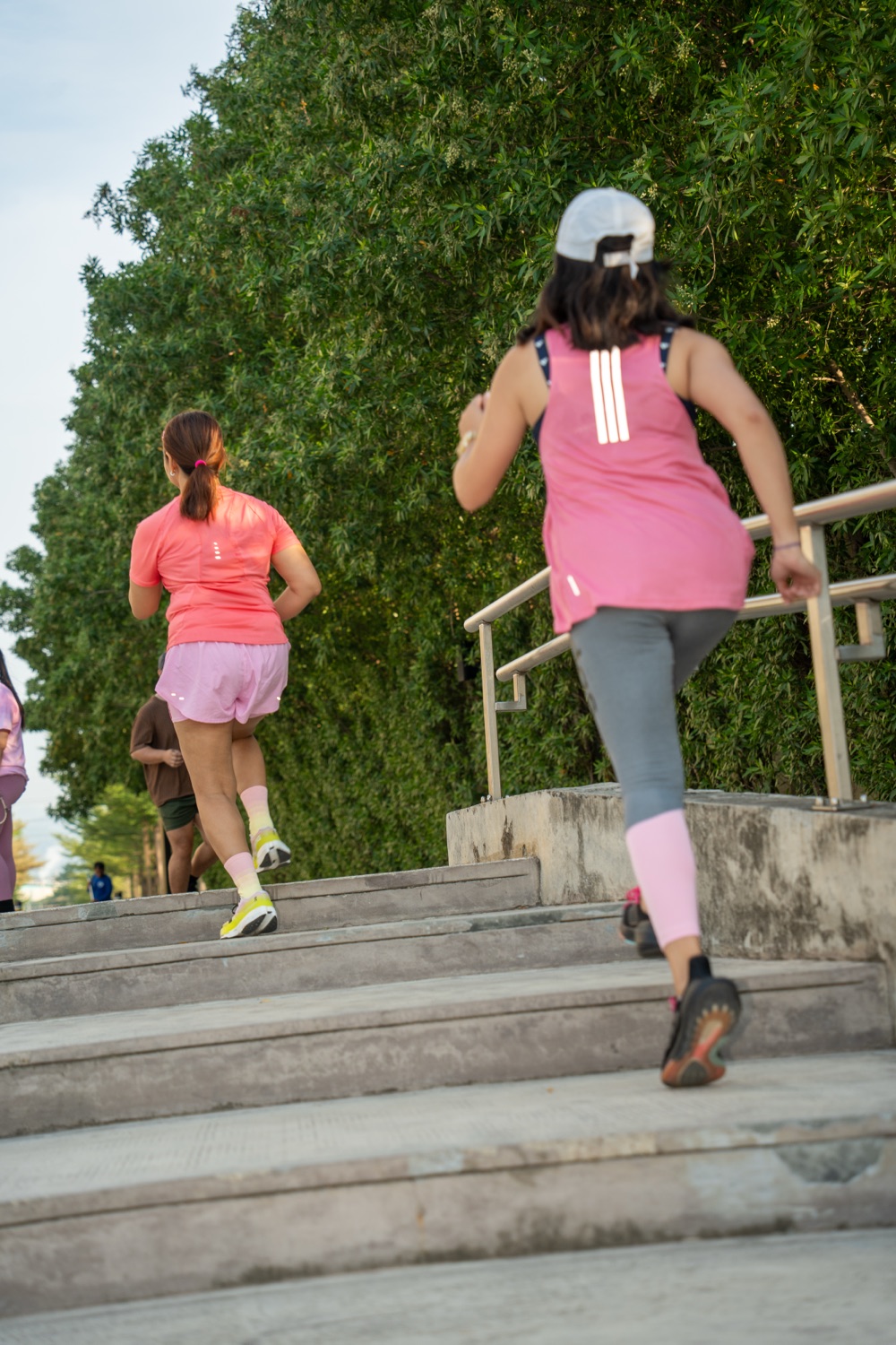 Two members climbing the steps together