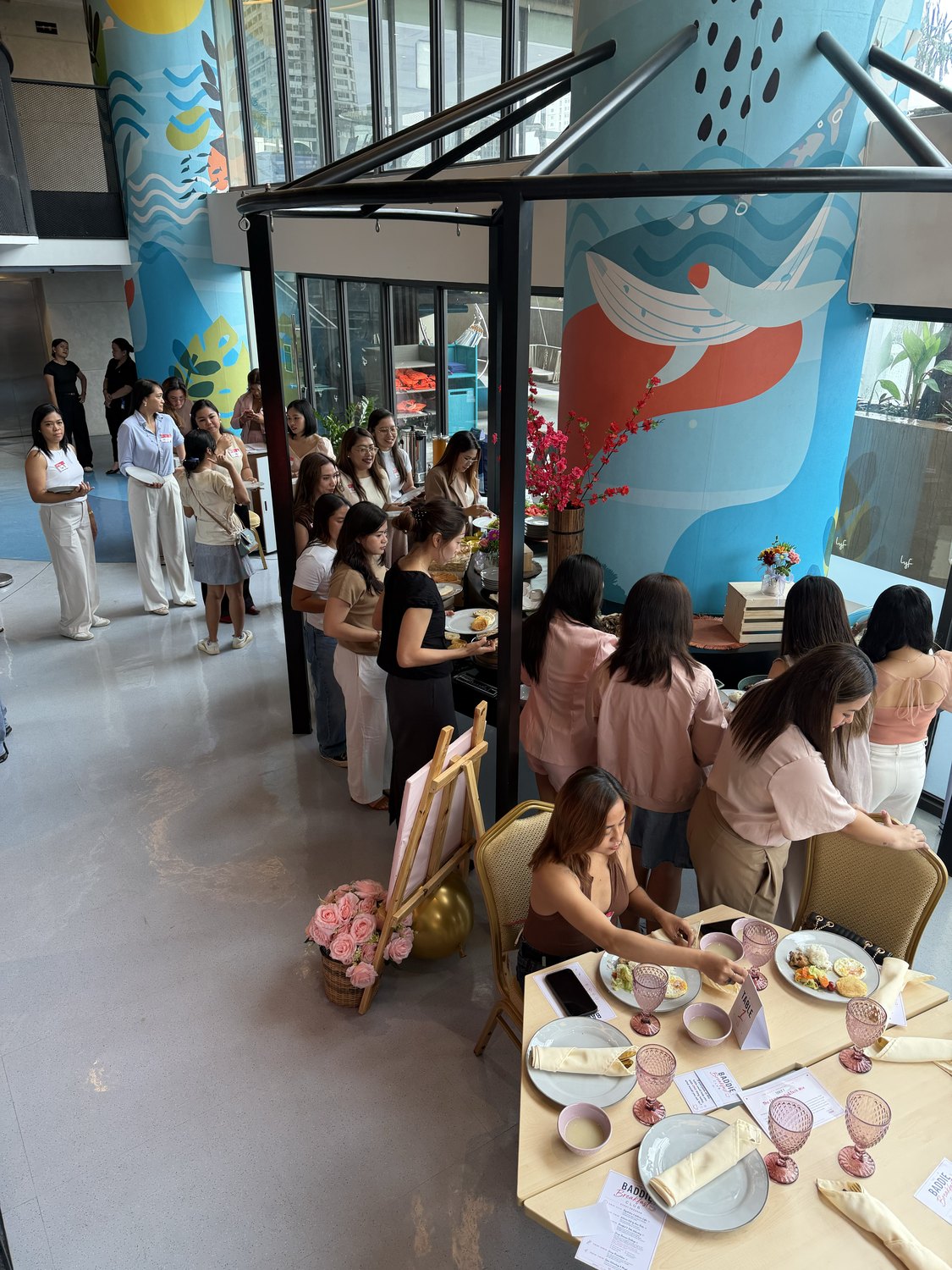 A wide view of the room with guests at their tables