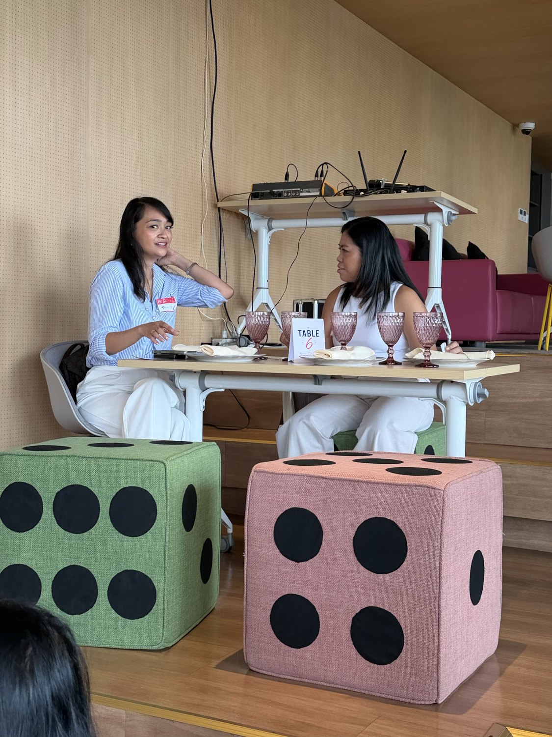 Two women in conversation at the dice table